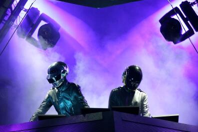 (FILES) In this file photo taken on April 29, 2006 Daft Punk performs at the Coachella Music Fesival in Indio, California. French electronic music stars Daft Punk have split up, their publicist confirmed on February 22, 2021, ending one of the era's defining dancefloor acts. The duo released a video titled "Epilogue" in which one of the robot duo is blown up in the desert, followed by a cutaway reading "1993-2021". / AFP / GETTY IMAGES NORTH AMERICA / Karl Walter 