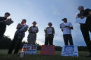 Death penalty protesters conduct a candlelight vigil outside the Greensville Correctional Center, Thursday, July 6, 2017, in Jarratt, Va. The prison is the site of the execution of William Morva, who is scheduled to receive a lethal injection on Thursday for the 2006 killings of a hospital security guard and sheriff's deputy. (AP Photo/Steve Helber)