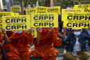Buddhist monks display placards during an anti-coup protest in Mandalay, Myanmar, Saturday, Feb. 27, 2021. Myanmar security forces cracked down on anti-coup protesters in the country's second-largest city Mandalay on Friday, injuring at least three people, two of whom were shot in the chest by rubber bullets and another who suffered a wound on his leg. "CRPH" in the placards stand for "Committee Representing Pyidaungsu Hluttaw." (AP Photo)