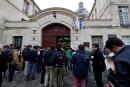 High school students wait outside the Charlemagne High School (Lycee Charlemagne) in Paris on June 15, 2016 prior to the test of philosophy as they take the baccalaureat exam (high school graduation exam). - Students across France are registered to take their written baccalaureat exams, starting today with the philosophy test. (Photo by FRANCOIS GUILLOT / AFP)