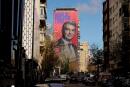 FILE PHOTO: A giant electoral poster of FC Barcelona presidential hopeful Joan Laporta is seen on a building next to the Santiago Bernabeu Stadium in Madrid, Spain - December 15, 2020. REUTERS/Juan Medina/File Photo