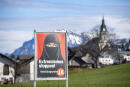 A poster supporting the initiative 'Yes to a ban on covering the face' is displayed at the village Buochs, Switzerland, Tuesday, Feb. 16, 2021. At a time when seemingly everyone in Europe is wearing masks to battle COVID-19, the Swiss go to the polls Sunday March 7, 2021, to vote on a long-laid proposal to ban face-coverings like niqabs and burqas worn by some Muslim women or by protesters in ski masks or bandannas. (Urs Flueeler/Keystone via AP)