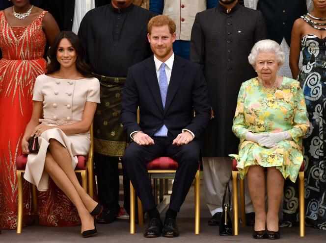 Meghan Markle, Duchess of Sussex, Prince Harry and Queen Elizabeth II at a reception in Buckingham Palace, London (UK), 26 June 2018.