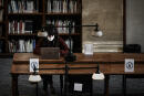 A student studies sitting apart due to the coronavirus, Covid-19, in the historical library at the Victoire Campus of the University of Bordeaux on January 20, 2021 in Bordeaux, southwestern France. - Tired, demoralised, precarious: French students are called to take to the streets to make their voices heard, even though only some of them will be able to resume classes at the end of January 2021, and their living conditions have deteriorated. (Photo by Philippe LOPEZ / AFP)