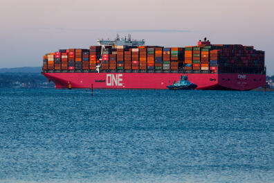 A tug escorts container ship 'One Apus' in to the River Solent near Southampton, U.K., on Thursday, May 14, 2020. Oils historic plunge below $0 a barrel pummeled portfolios, broke risk models and changed the way the worlds most important commodity is traded. Photographer: Luke MacGregor/Bloomberg via Getty Images