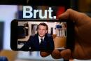 A journalist watches a live stream interview of French President Emmanuel Macron to the digital news platform Brut on December 4, 2020 in Paris. (Photo by BERTRAND GUAY / AFP)