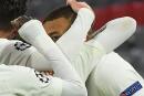 Paris Saint-Germain's French forward Kylian Mbappe celebrates scoring the 2-3 goal with his team-mates during the UEFA Champions League quarter-final first leg football match between FC Bayern Munich and Paris Saint-Germain (PSG) in Munich, southern Germany, on April 7, 2021. / AFP / Christof STACHE 