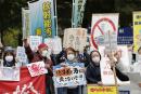 People rally to protest against the Japanese government's decision to discharge contaminated radioactive wastewater from Fukushima Daiichi nuclear power plant into the sea, in front of the Fukushima prefectural government headquarters in Fukushima, April 13, 2021, in this photo taken by Kyodo. Kyodo/via REUTERS ATTENTION EDITORS - THIS IMAGE WAS PROVIDED BY A THIRD PARTY. MANDATORY CREDIT. JAPAN OUT. NO COMMERCIAL OR EDITORIAL SALES IN JAPAN