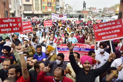 AMRITSAR, INDIA - MARCH 15: Bank employees demonstrating during a two-day nationwide strike called by United Forum of Bank Unions (UFBU) against the proposed privatization of public sector banks, at Hall Gate on March 15, 2021 in Amritsar, India. Nine bank unions under the banner of the United Forum of Bank Union (UFBU) on Monday started a nationwide two-day strike against the privatisation of public sector banks and retrograde banking reforms. As many as 10 lakh bank employee are expected to participate in the strike.(Photo by Sameer Sehgal/Hindustan Times via Getty Images)