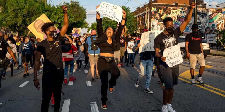 ATLANTA, GA - APRIL 20: Qri Montague (center) and others march through the streets after the verdict was announced for Derek Chauvin on April 20, 2021 in Atlanta, United States. Former police officer Derek Chauvin was on trial on second-degree murder, third-degree murder and second-degree manslaughter charges in the death of George Floyd May 25, 2020. After video was released of then-officer Chauvin kneeling on Floyd's neck for nine minutes and twenty-nine seconds, protests broke out across the U.S. and around the world. The jury found Chauvin guilty on all three charges.   Megan Varner/Getty Images/AFP
== FOR NEWSPAPERS, INTERNET, TELCOS & TELEVISION USE ONLY ==
