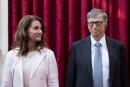 FILE PHOTO: Philanthropist and co-founder of Microsoft, Bill Gates (R) and his wife Melinda listen to the speech by French President Francois Hollande, prior to being awarded Commanders of the Legion of Honor at the Elysee Palace in Paris, France, April 21, 2017. REUTERS/Kamil Zihnioglu/Pool/File Photo