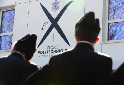 Polytechnique school students wait prior to the arrival of the president of French telecom group Altice Patrick Drahi to attend the inauguration of a building "Drahi-X Novation Center" dedicaded to entrepreneurship and innovation at the Ecole Polytechnique, in Palaiseau, southwest of Paris, on April 19, 2016. (Photo by ERIC PIERMONT / AFP)