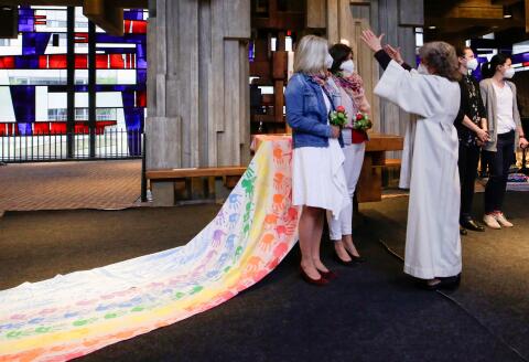 Pastoral worker Brigitte Schmidt blesses same-sex couples during a ceremony in a Catholic church in Cologne, Germany, May 10, 2021. REUTERS/Thilo Schmuelgen