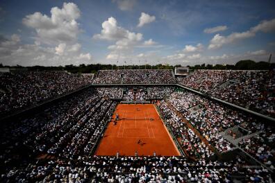 (FILES) In this file photo taken on June 8, 2018 Spectators watch Spain's Rafael Nadal (TOP) as he plays Argentina's Juan Martin del Potro during their men's singles semi-final match on day thirteen of The Roland Garros 2018 French Open tennis tournament in Paris. A health pass will be required for spectators wishing to access the Roland-Garros stadium (from May 30 to June 13, 2021), the general manager of the French Tennis Federation, Amelie Oudea-Castera, announced on May 12, 2021. Also, Roland-Garros will welcome up to 5,388 spectators until June 8, 2021, then up to 13,146 from June 9, 2021 thanks to the government authorization to raise the limit of the gauge to 65%. / AFP / CHRISTOPHE SIMON 