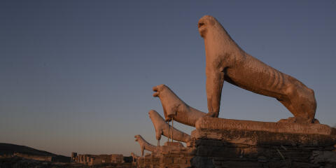The guardian Lions dedicated by the Naxians to the Sanctuary of ancient Greek God Apollo on 7th century BC, are lighted with the first morning light, in the ancient island of Delos, Greece , on Wednesday, May 12, 2021. Greece says its tourism services will open on May 15 when a ban on travel between different regions of the country will also be lifted. ( AP Photo/Petros Giannakouris)