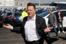 (FILES) In this file photo taken on September 03, 2020 Tesla CEO Elon Musk gestures as he arrives to visit the construction site of the future US electric car giant Tesla, in Gruenheide near Berlin. Carmaker Tesla's "gigafactory" near Berlin will not open in July as planned due to changes in the building permit application, the region said on April 27, without giving a new date. / AFP / Odd ANDERSEN
