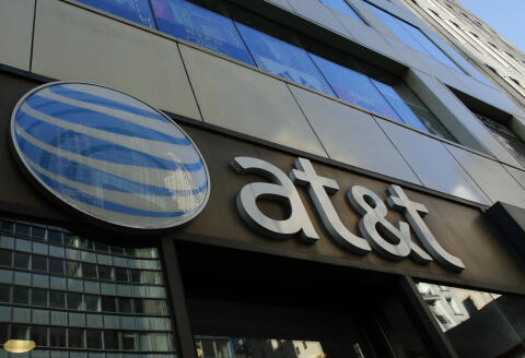 An AT&amp;T store is seen on 5th Avenue in New York on October 23, 2016. - AT&amp;T unveiled a mega-deal for Time Warner that would transform the telecom giant into a media-entertainment powerhouse positioned for a sector facing major technology changes. The stock-and-cash deal is valued at $108.7 billion including debt, and gives a value of $84.5 billion to Time Warner -- a major name in the sector that includes the Warner Bros. studios in Hollywood and an array of TV assets such as HBO and CNN. (Photo by KENA BETANCUR / AFP)