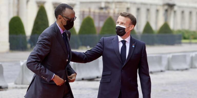 France's President Emmanuel Macron (R) welcomes Rwanda's President Paul Kagame upon his arrival for an international conference on Sudan which aims to provide financing breathing room for its Prime Minister as he pursues economic reforms in Paris on May 17, 2021. The French government promised to lend $1.5 billion to Sudan to help it pay off its massive foreign debt, kicking off an international summit aimed at helping the aspiring democracy emerge from decades of authoritarian rule.  / AFP / Ludovic MARIN
