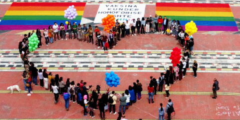 An aerial photograph taken with a drone shows members and activists of the LGBTQ+ community standing in a heart-shaped formation during International Day Against Homophobia, Transphobia and Biphobia at Mother Theresa Square, as the coronavirus disease (COVID-19) pandemic continues, in Tirana, Albania May 17, 2021. REUTERS/Florion Goga