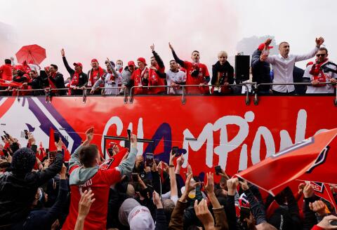 Soccer Football - Ligue 1 - Lille receive Ligue 1 trophy - Lille, France - May 24, 2021 Lille players and staff on a bus as fans celebrate during the parade REUTERS/Pascal Rossignol