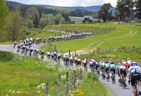 The pack rides during the second stage of the 73rd edition of the Criterium du Dauphine cycling race, 173km between Brioude and Saugues on May 31, 2021. / AFP / Alain JOCARD
