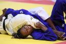 France's Clarisse Agbegnenou (white) fights against Cuba's Maylin del Toro Carvajal (blue) in the women's -63kg category during the fourth day of the 2021 Judo World Championships at 'Papp Laszlo' Arena of Budapest, Hungary, on June 9, 2021. / AFP / ATTILA KISBENEDEK 