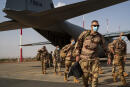 French Barkhane soldiers arriving from Gao, Mali, disembark from a US Air Force C130 cargo plane at Niamey, Niger base Wednesday June 9, 2021, before transferring back to their Bases in France. French President Emmanuel Macron announced at a press conference Thursday June 10, 2021 That operation Barkhane would end and be replaced by support for local partners and counter terrorism. (AP Photo/Jerome Delay)