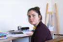 Eloïse, élève de terminale, dans le bureau de la chambre de son frère, qu'elle utilise pour ses révisions. A Coye-La-Forêt, le 16 juin 2021.