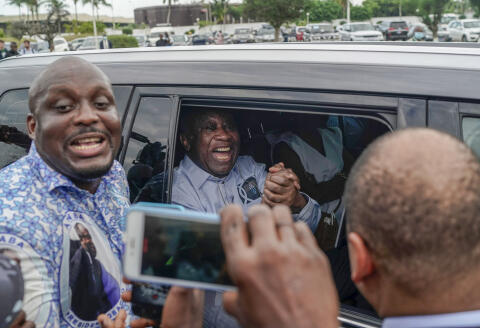 Former Ivorian president Laurent Gbagbo arrives at the international airport, in Abidjan, Ivory Coast, Thursday, June 17, 2021. After nearly a decade, Gbagbo returns to his country following his acquittal on war crimes charges was upheld at the International Criminal Court earlier this year. (AP Photo/Leo Correa)