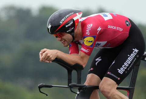 Denmark's Kasper Asgreen competes during the fifth stage of the Tour de France cycling race, an individual time-trial over 27.2 kilometers (16.9 miles) with start in Change and finish in Laval Espace Mayenne, France, Wednesday, June 30, 2021. (AP Photo/Daniel Cole)