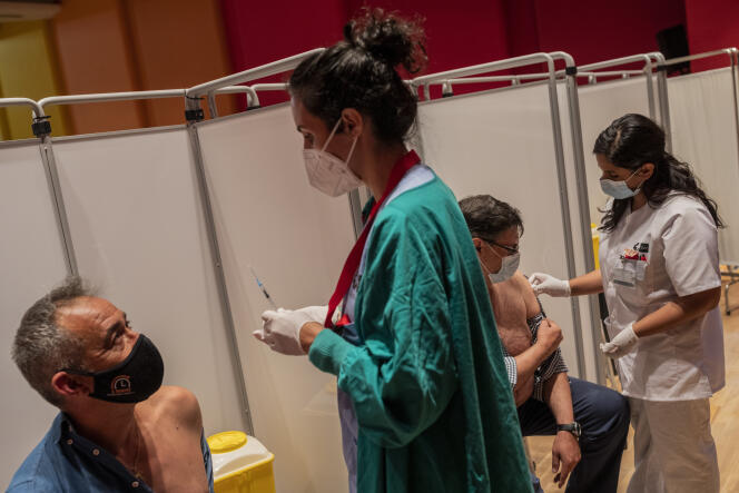People are vaccinated on May 13, 2021 near Madrid, Spain.