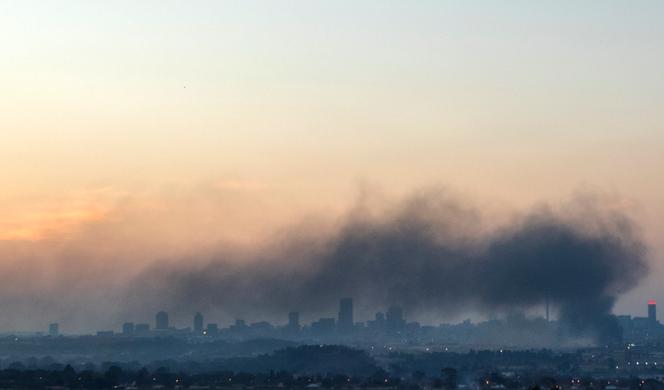 A cloud of smoke over Johannesburg, after protests, Sunday 11 July 2021.