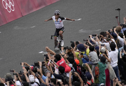 Richard Carapaz of Ecuador reacts after winning the men's cycling road race at the 2020 Summer Olympics, Saturday, July 24, 2021, in Oyama, Japan. (AP Photo/Christophe Ena)