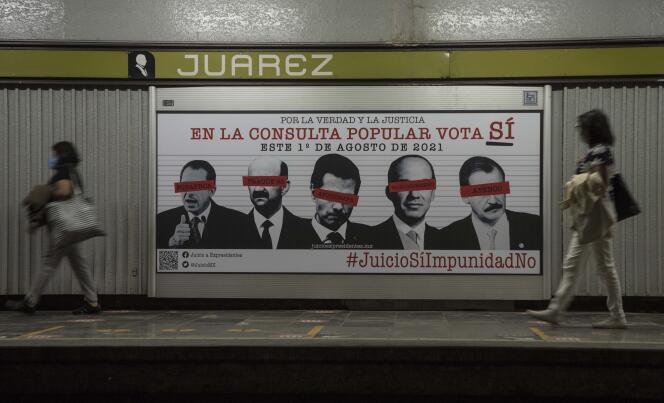 A poster on the Mexico City Metro invites Mexican citizens to take part in the referendum, Saturday, July 31, 2021.