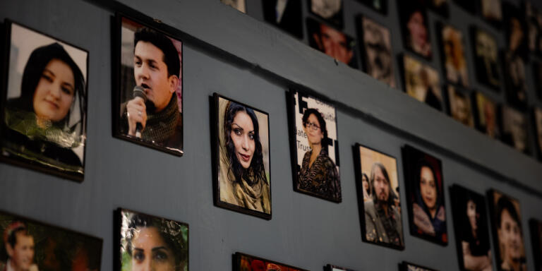 Photos of prominent Afghans hang on the wall at the cultural center in Puli Surkh, Kabul, Afghanistan on August 8, 2021.