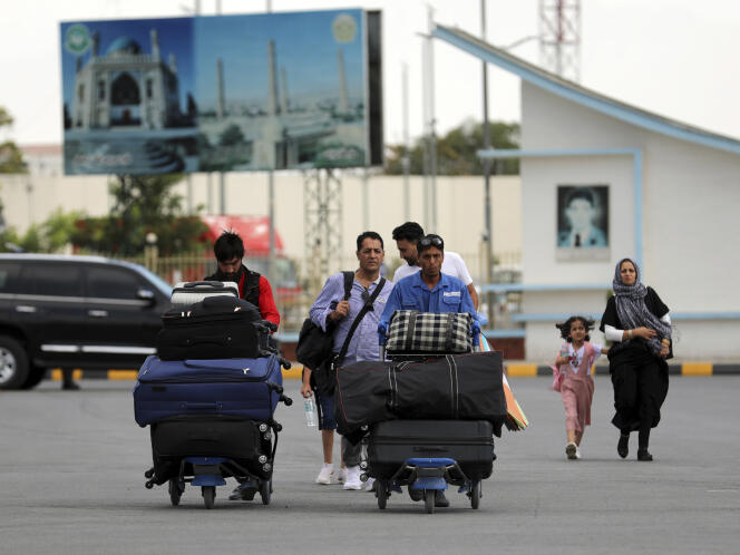People leaving Kabul through the airport, August 14, 2021.