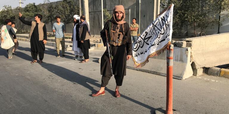 A member of Taliban stands outside the Interior Ministry in Kabul, Afghanistan, August 16, 2021. REUTERS/Stringer