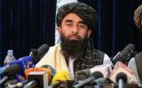 Taliban spokesperson Zabihullah Mujahid looks on as he addresses the first press conference in Kabul on August 17, 2021 following the Taliban stunning takeover of Afghanistan. (Photo by Hoshang Hashimi / AFP) 