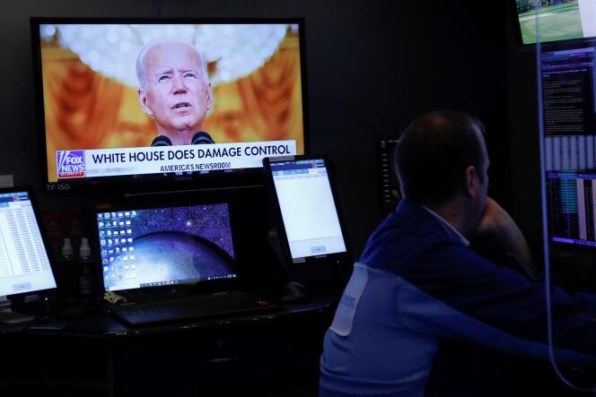 US President Joe Biden during his address to the nation regarding the situation in Afghanistan as traders work in the dealing room of the New York Stock Exchange on August 17, 2021.