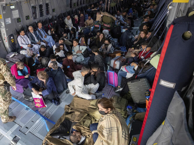 People were evacuated on a German plane at Kabul airport on August 17.