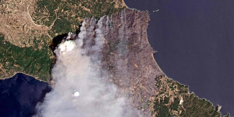 TOPSHOT - This handout picture taken on August 7, 2021 and released on August 9, 2021 by 2021 Planet Labs shows fires on the Greek island of Evia (Euboea).  Firefighters tried on August 9, 2021 to prevent fires from reaching key communities and a thick forest that could fuel an inferno that one official said has destroyed hundreds of homes in seven days on the Greek island of Evia. If most of nearly two weeks of fires had stabilised or receded in other parts of Greece, the ones on rugged and forested Evia were the most worrying and created apocalyptic scenes.
 - RESTRICTED TO EDITORIAL USE - MANDATORY CREDIT 