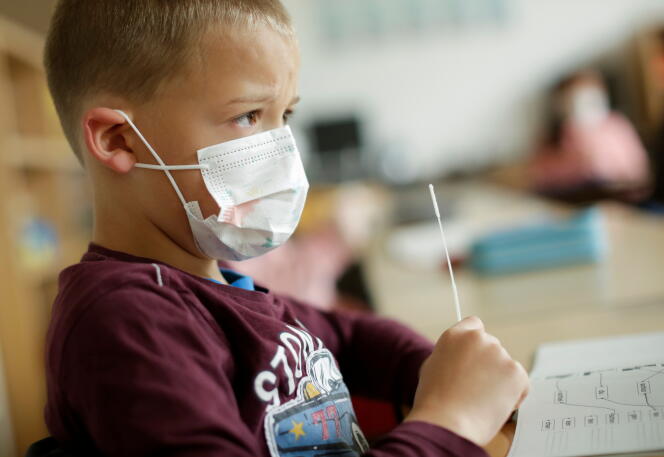 A schoolboy takes a Covid-19 test on May 17, 2021, in Bonn, Germany.