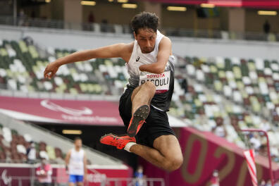 Afghanistan's Hossain Rasouli competes in the men's T47 long jump during the 2020 Paralympics at the National Stadium in Tokyo, Tuesday, Aug. 31, 2021. (AP Photo/Eugene Hoshiko)