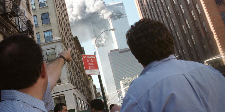 FILE PHOTO - Pedestrians react to the World Trade Center collapse
September 11, 2001. Richard Cohen/REUTERS

AC