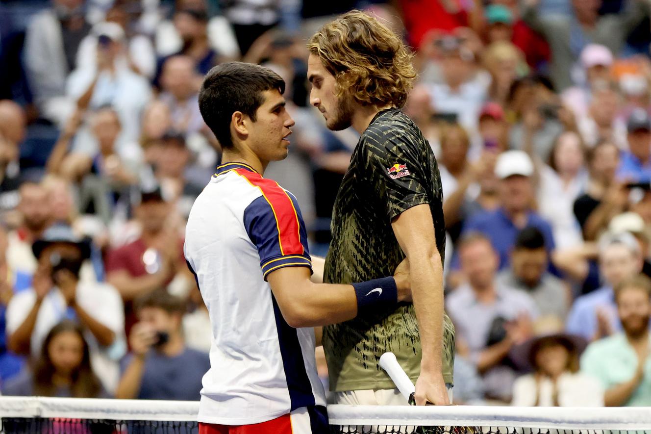 Young Carlos Alcaraz (left) took out elder Stefanos Tsitsipas (right) after a thrilling match in the third round of the US OPen on September 3, 2021.