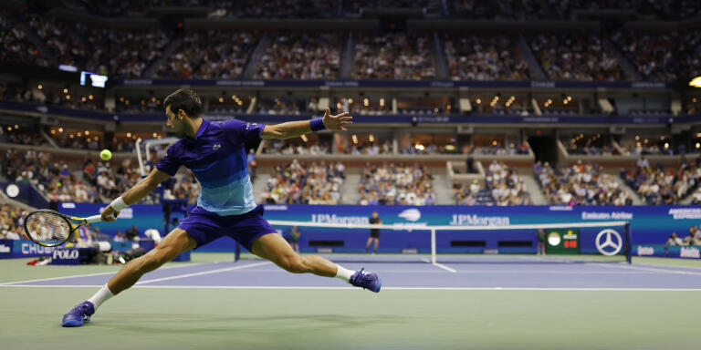 Sep 6, 2021; Flushing, NY, USA; Novak Djokovic of Serbia reaches for a backhand against Jenson Brooksby of the United States (not pictured) on day eight of the 2021 U.S. Open tennis tournament at USTA Billie Jean King National Tennis Center. Mandatory Credit: Geoff Burke-USA TODAY Sports