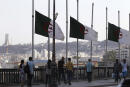 Algerian flags fly at half-staff along the seaside walk in Algiers, Saturday, Sept. 18, 2021. Algeria's leader declared a three-day period of mourning starting Saturday for former President Abdelaziz Bouteflika, whose 20-year-long rule, riddled with corruption, ended in disgrace as he was pushed from power amid huge street protests when he decided to seek a new term. Bouteflika, who had been ailing since a stroke in 2013, died Friday at 84. (AP Photo/Fateh Guidoum)