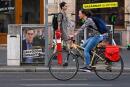 A cyclist drives past a campaign poster featuring Budapest Mayor and candidate for prime minister Gergely Karacsony of opposition party 'Parbeszed Magyarorszagert' (Dialogue for Hungary) with the lettering reading 'I will defeat (Hungarian Prime Minister) Orban!', in downton Budapest on September 15, 2021. Hungary's newly united opposition is gearing up for candidate primary elections starting on September 18, an innovation it hopes is the key to ousting PM Viktor Orban at a general election next spring. (Photo by ATTILA KISBENEDEK / AFP) 