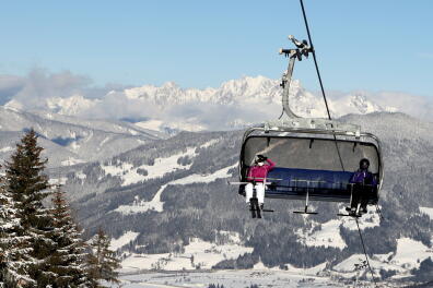 FILE PHOTO: Skiers practise COVID-19 social distancing on a chairlift in Flachau, Austria January 15, 2021. REUTERS/Leonhard Foeger/File Photo