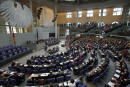 FILE - This Oct. 22, 2013 file photo shows a general view of the German Federal Parliament, Bundestag in Berlin, Germany. German voters elect a new parliament on Sunday, Sept. 26, 2021, a vote that will determine who succeeds Chancellor Angela Merkel after her 16 years in power. (AP Photo/Michael Sohn, file)
